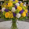 A joyful and sophisticated floral arrangement designed with radiant yellow roses, sunny