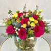 A vibrant and joyful arrangement featuring bold hot pink roses, cheerful yellow