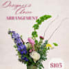 Mixed floral arrangement with blue, pink, white, and yellow blooms