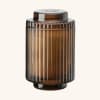 Amber ribbed glass candle jar with a lid