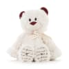 White teddy bear with burgundy ears and nose, tied with a ribbon