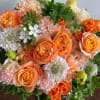 this is a beautiful, passionate, artful arrangement arranged in a low vase