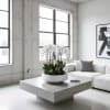 White orchids in a low white bowl on a coffee table