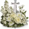 An elegant display of faith and divine peace, this beautiful arrangement will