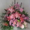 Shades of pinks and lavenders in a white urn