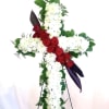 Cross-shaped floral tribute with red roses and white chrysanthemums