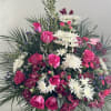 Pink roses and white daisies in a large standing arrangement