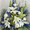 A single-faced urn arrangement that evokes a peaceful, heavenly rest with white