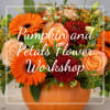 Orange and peach floral arrangement in a pumpkin-shaped container