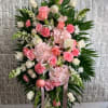 Standing floral spray with pink and white roses and carnations