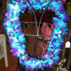 Heart-shaped floral wreath with bright blue and purple flowers
