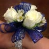 Spray roses and wax flower decorated on a rhinestone band. 