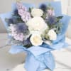 A beautiful hand-wrapped inspired by Columbia&rsquo;s signature blue, featuring elegant white roses