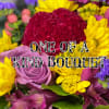 Colorful bouquet with roses, daisies, and purple filler flowers