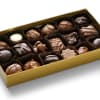 Box of assorted chocolates in a gold tray