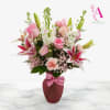 Soft, elegant, and full of charm, this arrangement features graceful pink lilies