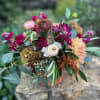 A warm yet vibrant mix of stock, tulips, lisianthus, antique hydrangea and