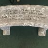 Stone memorial plaque with an engraved family remembrance message