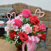 A sweet and vibrant Valentine&rsquo;s Day arrangement featuring red and hot pink