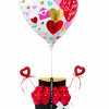 Heart balloon above red roses in a gift box with heart picks