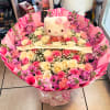 Pink and cream rose bouquet with a Hello Kitty plush centerpiece