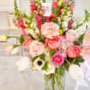 Pink and white mixed bouquet in a clear glass vase