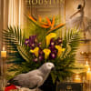 This arrangement is luxurious tropical composition filled with movement, texture, and vibrant