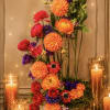 A striking contemporary floral sculpture designed with dramatic vertical movement and artistic