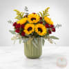 Sunflower and red rose arrangement in a green vase