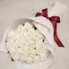 A stunning arrangement of premium white roses, beautifully wrapped in elegant ivory