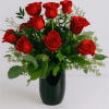 Velvety red roses arranged in a compact, rounded bouquet make an immediate