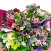 Assorted rose bouquets wrapped in colorful paper