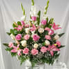 Beautiful arrangement for celebration of life, in soft pastels colors of pink