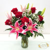Beautiful pink and white stargazers, deep red roses, lush accent greens, looks