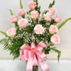 Show how much you care with a dozen delicate pink roses, artfully