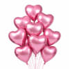 Cluster of pink heart-shaped balloons on strings