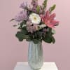 White, soft pastel pinks and airy lavender blooms lift upward in a
