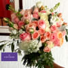 Peach Blush Romance Bouquet is an elegant hand-tied floral design featuring peach