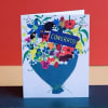 Greeting card with a colorful flower bouquet and "CONGRATS!" text