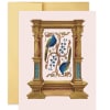 Decorative card with two blue birds and floral vines in an ornate gold frame