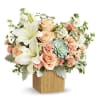 Reminiscent of a desert sunrise, this modern mix of peach blooms, white