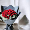 A dense, rounded cluster of velvety red roses makes an immediate statement-THE