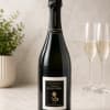 Bottle of champagne with two filled flutes beside it