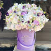 Beautiful arrangement with premium flowers in our signature lavender velvet box 