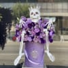Arrangement of fresh purple and lavender flowers with our scary skeleton with