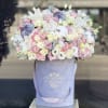 Beautiful very soft pastel colors arrangement in our signature grey velvet box