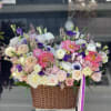 Mix of fresh flowers in a beautiful basket 