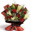 Bouquet of red roses and white lilies wrapped in red and black paper