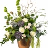 Mixed floral arrangement with white roses and green succulents in a copper vase