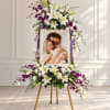 Standing floral frame with white lilies and purple orchids around a photo